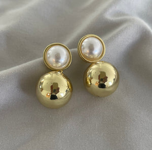 Elegant chunky pearls and bold earrings