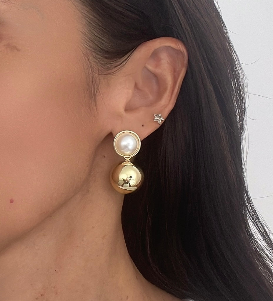 Elegant chunky pearls and bold earrings