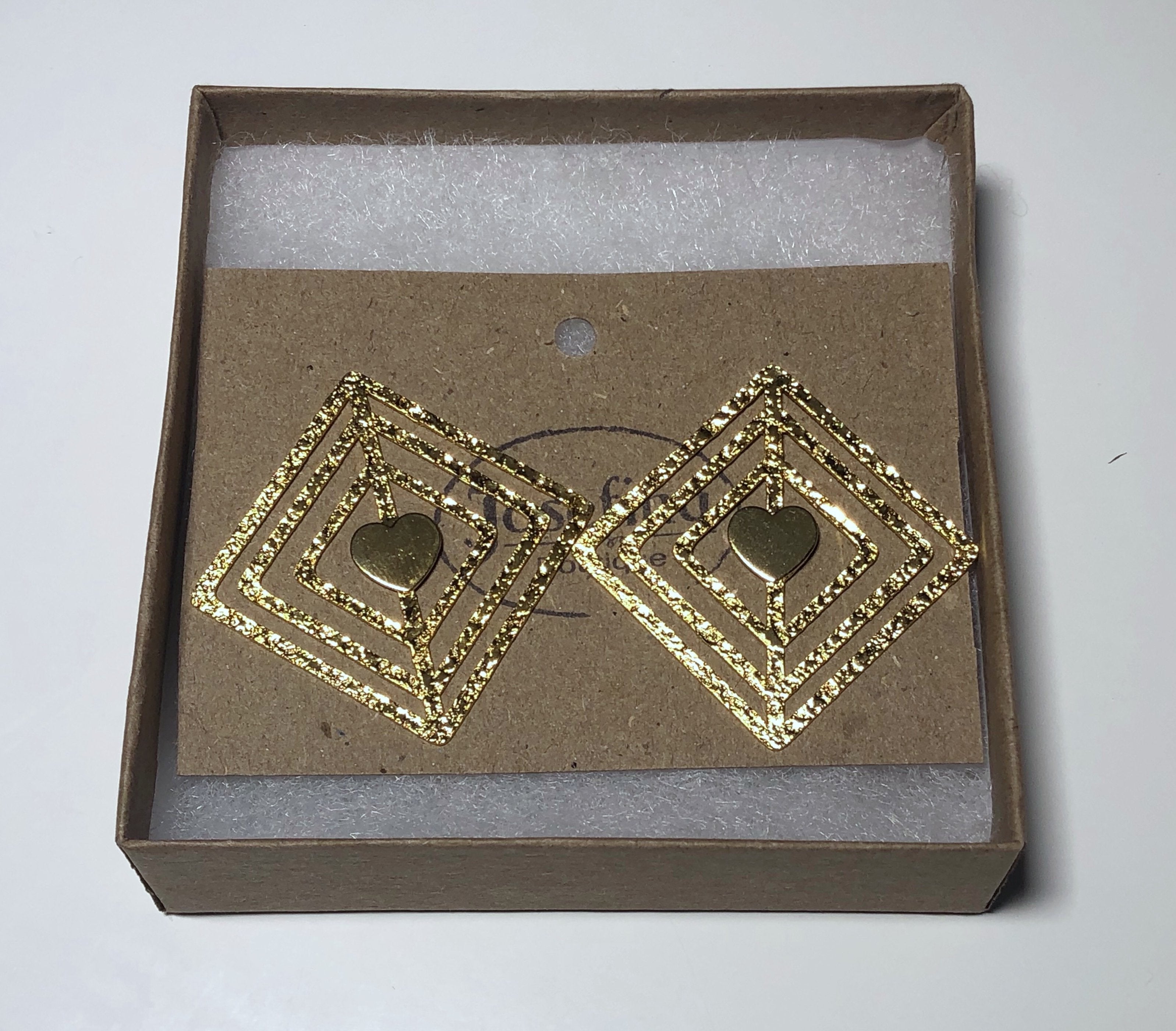 Heart in diamond earrings made of bronze with elegant texture.  For a great casual look day or night.